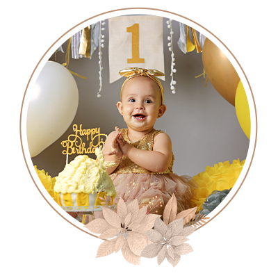 Beautiful little girl in yellow and pink dress with sweet cake