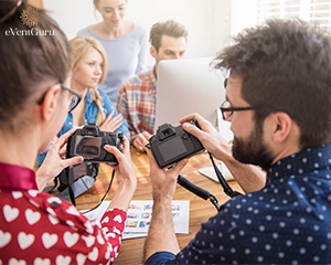 two photographer focus on work