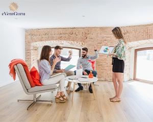 Woman showing charts to colleagues